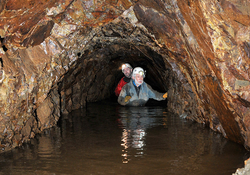 Club members wading along Yew Tree level to reach the dig site