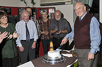 Dave Adams cuts the cake, watched by Boo Vernon, Alan & Bob Taylor, Cara Allison & Rob Vernon.